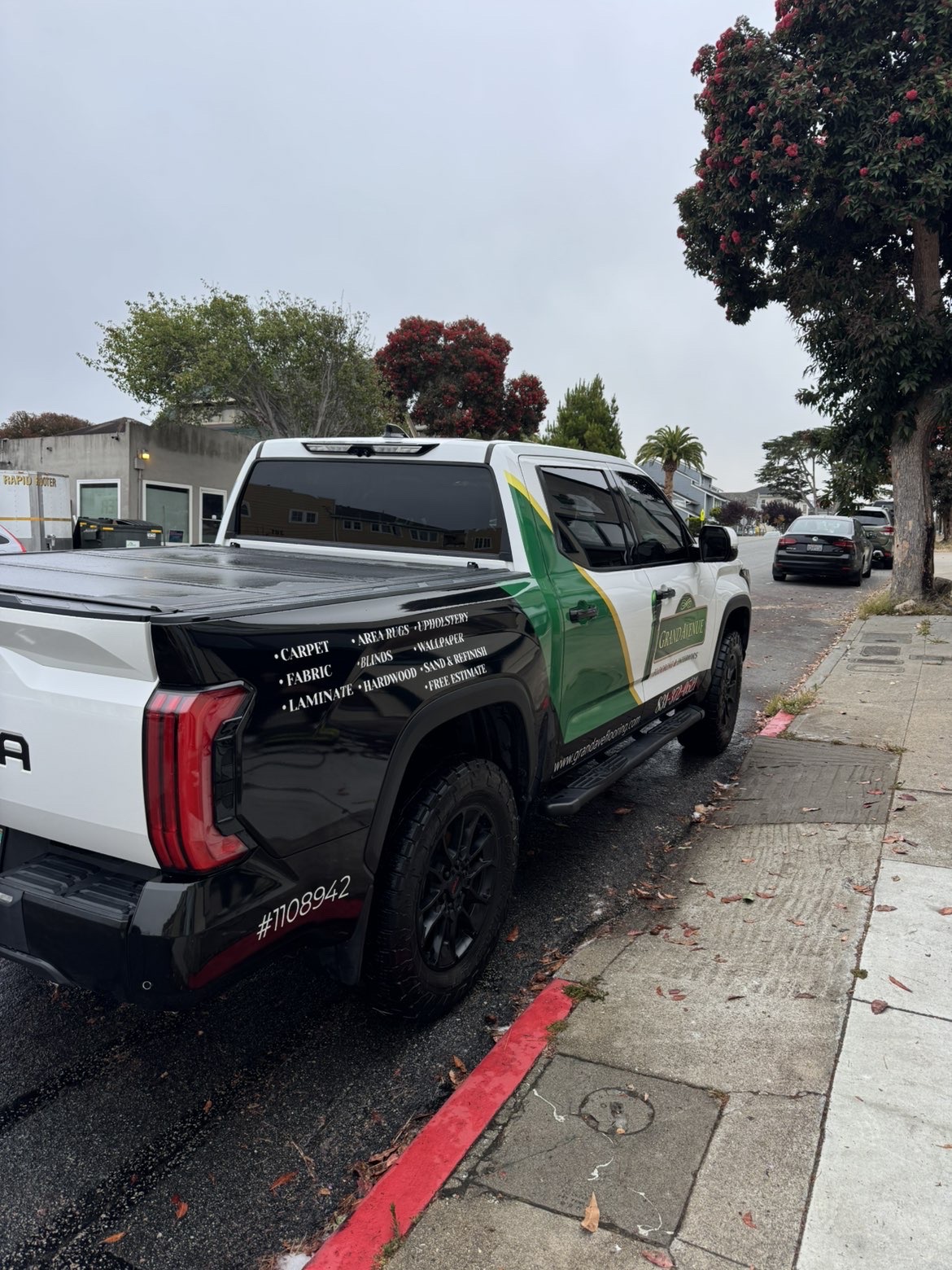 Black and white branded work truck after professional fleet detailing