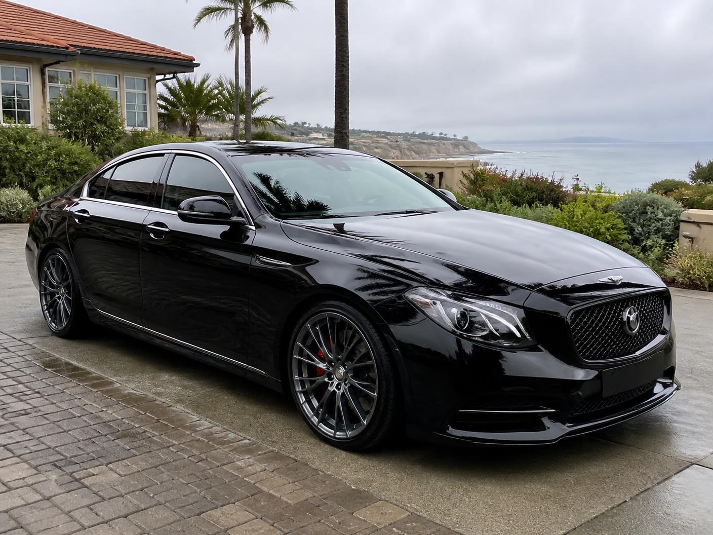 Freshly detailed white sedan with mirror-gloss paint in Monterey